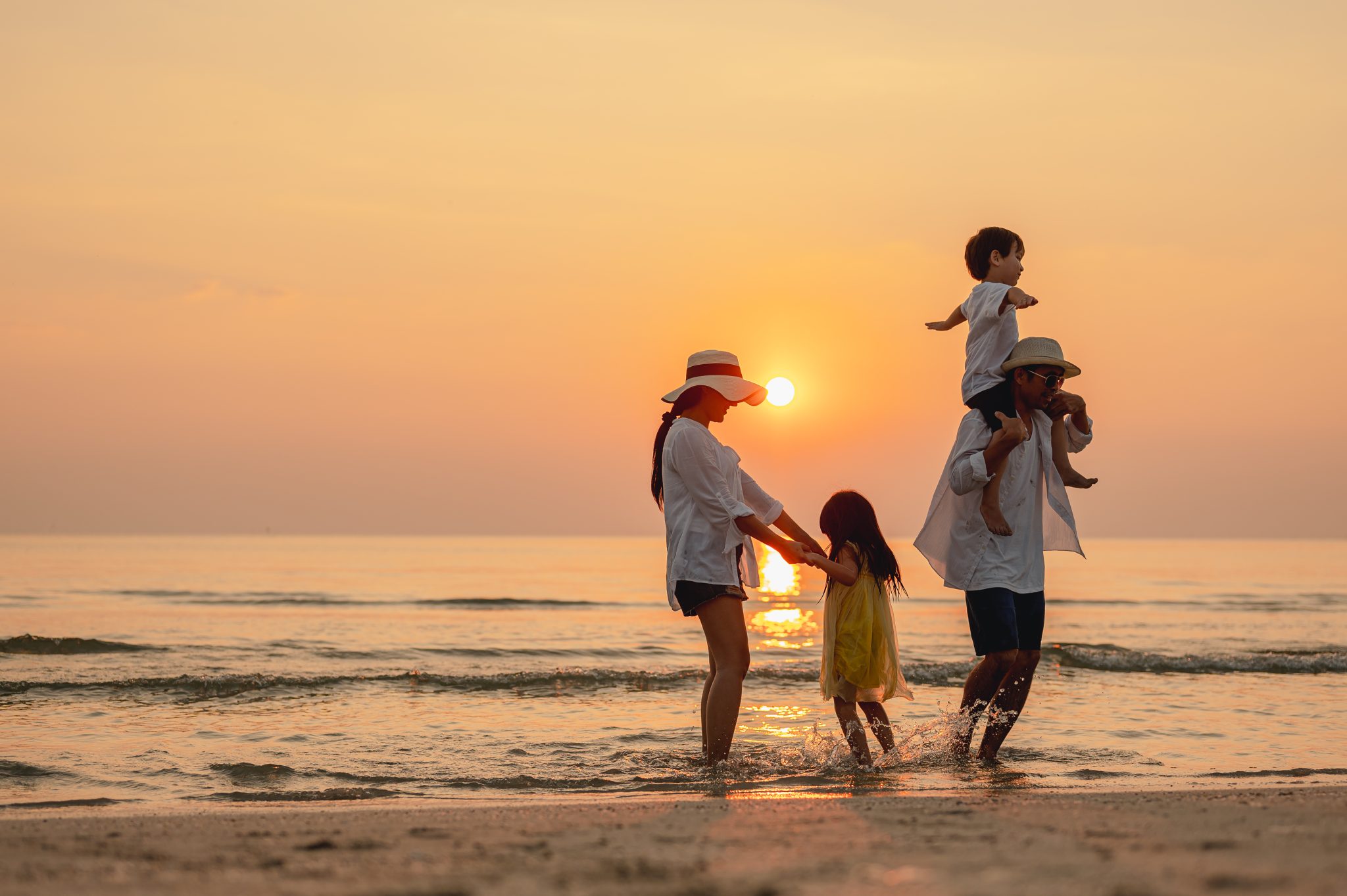 Family enjoying New York suburbs on the beach