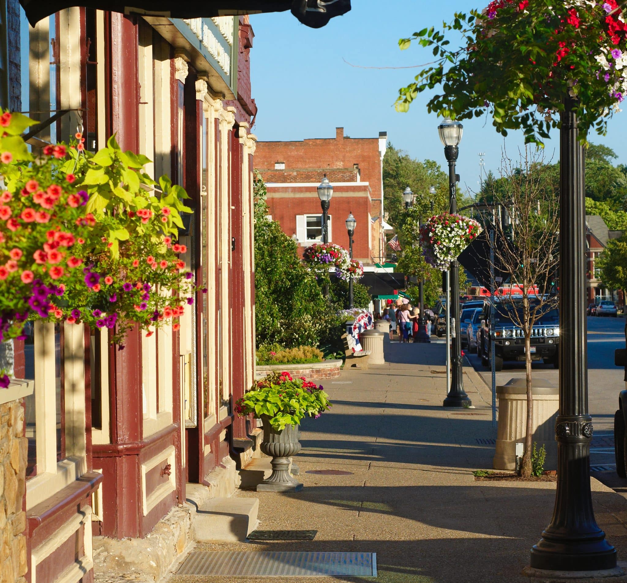 Colorful sidewalk with quaint shops and flowers