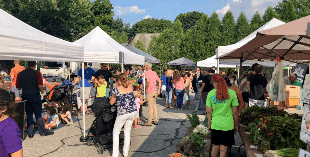 People at a farmers market in Belmont, MA
