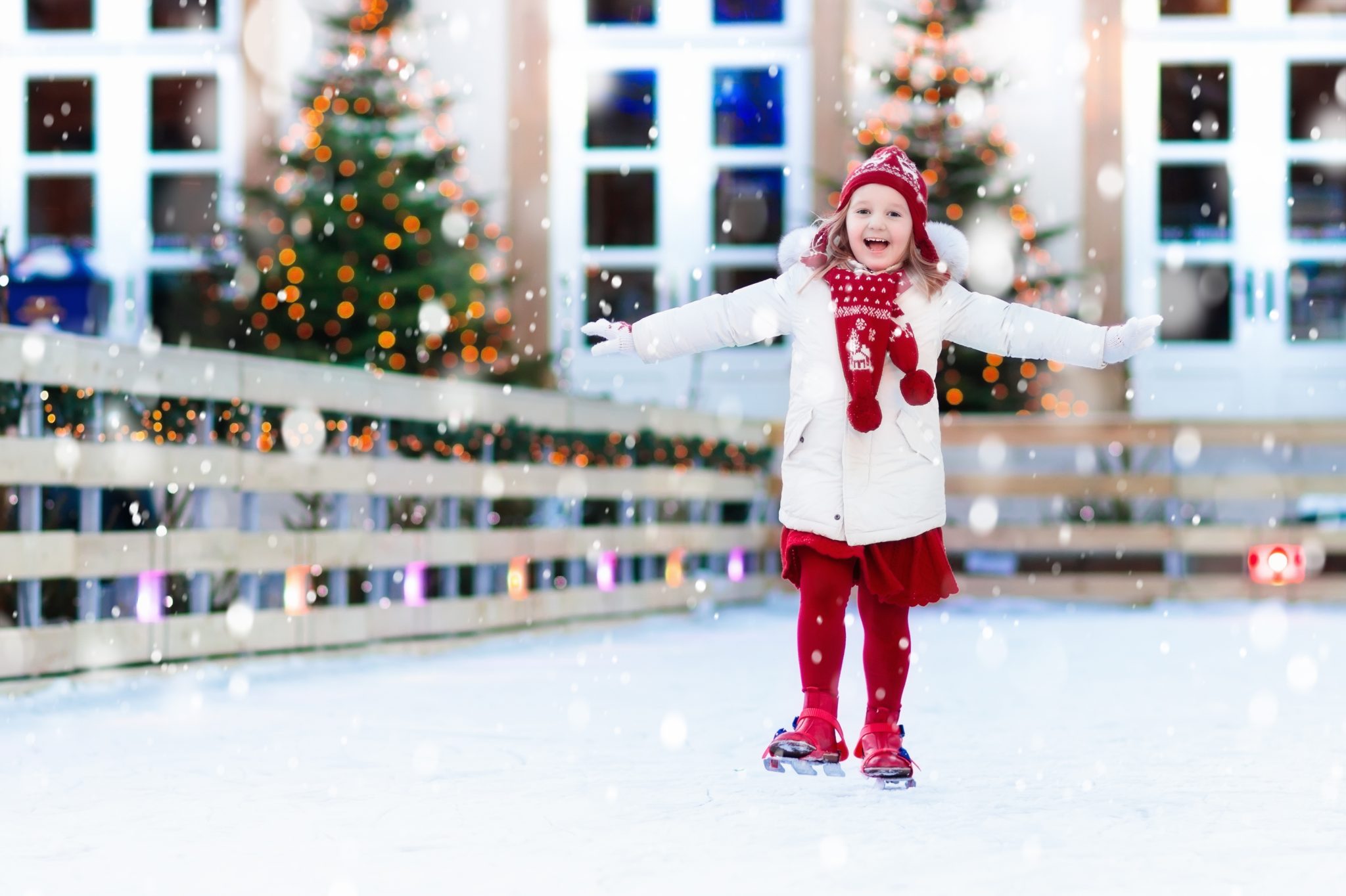 Child ice skating in winter