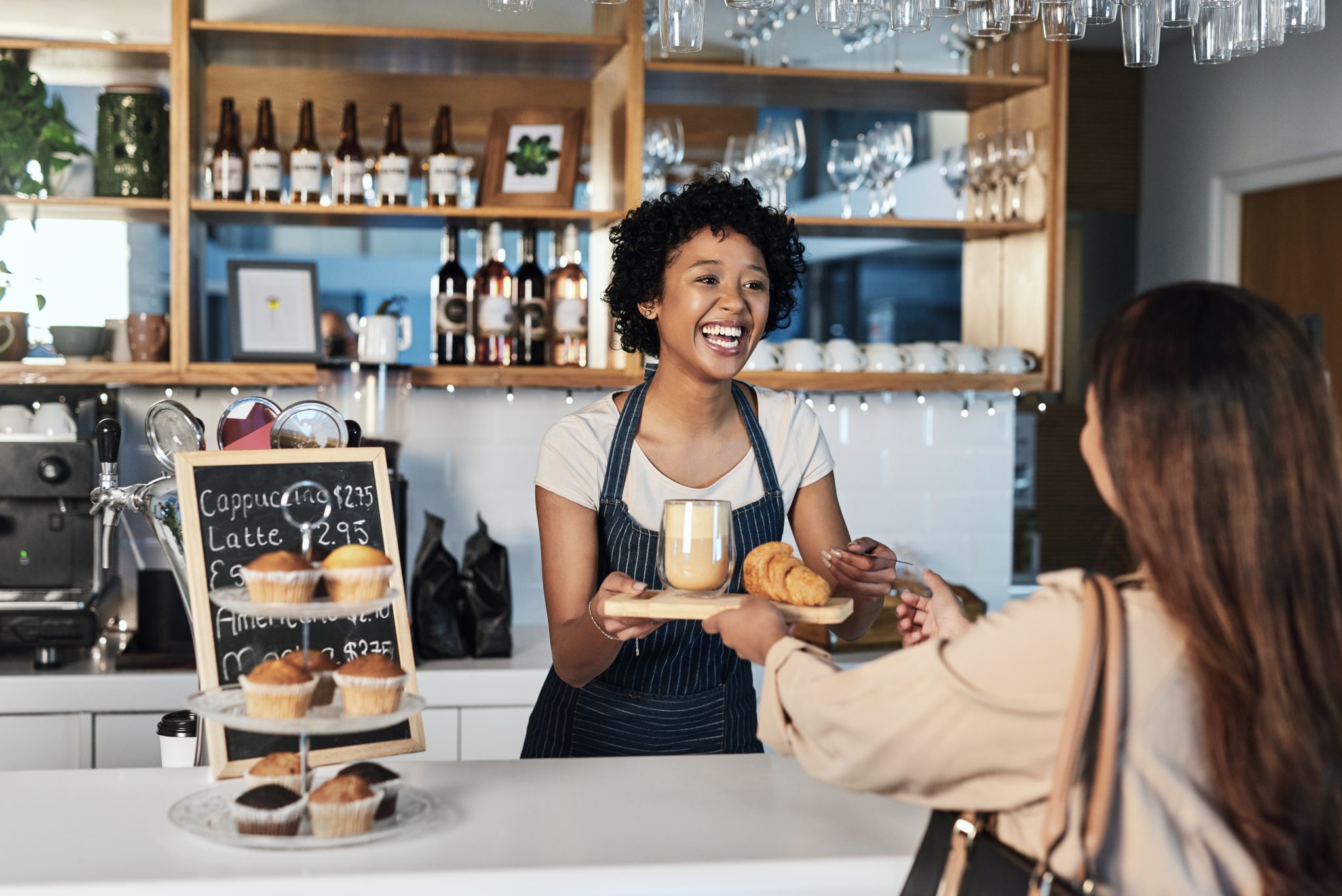 Friendly local coffee shop owner and customer