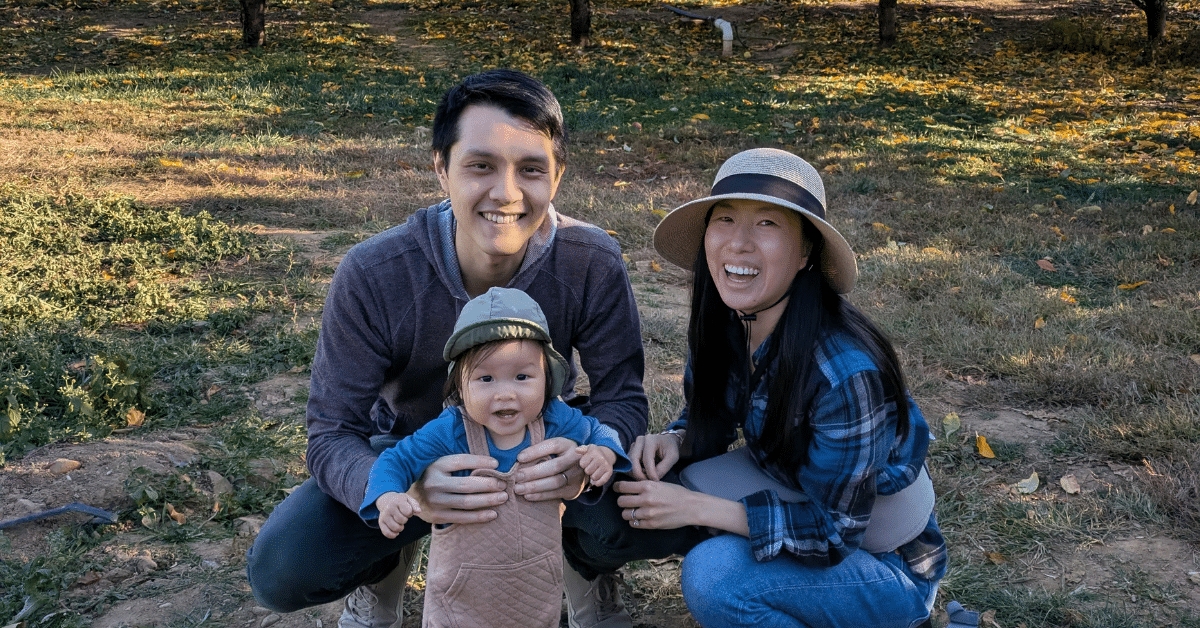 Diana Lee Family in Westfield NJ Diana Lee, her husband, and their young daughter spending time together outdoors in New Jersey after finding their ideal suburban community.