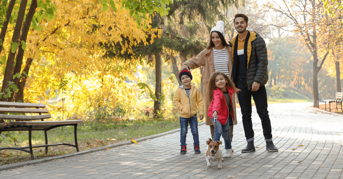 September in the Suburbs Family walking through a suburban park in early fall while exploring a neighborhood