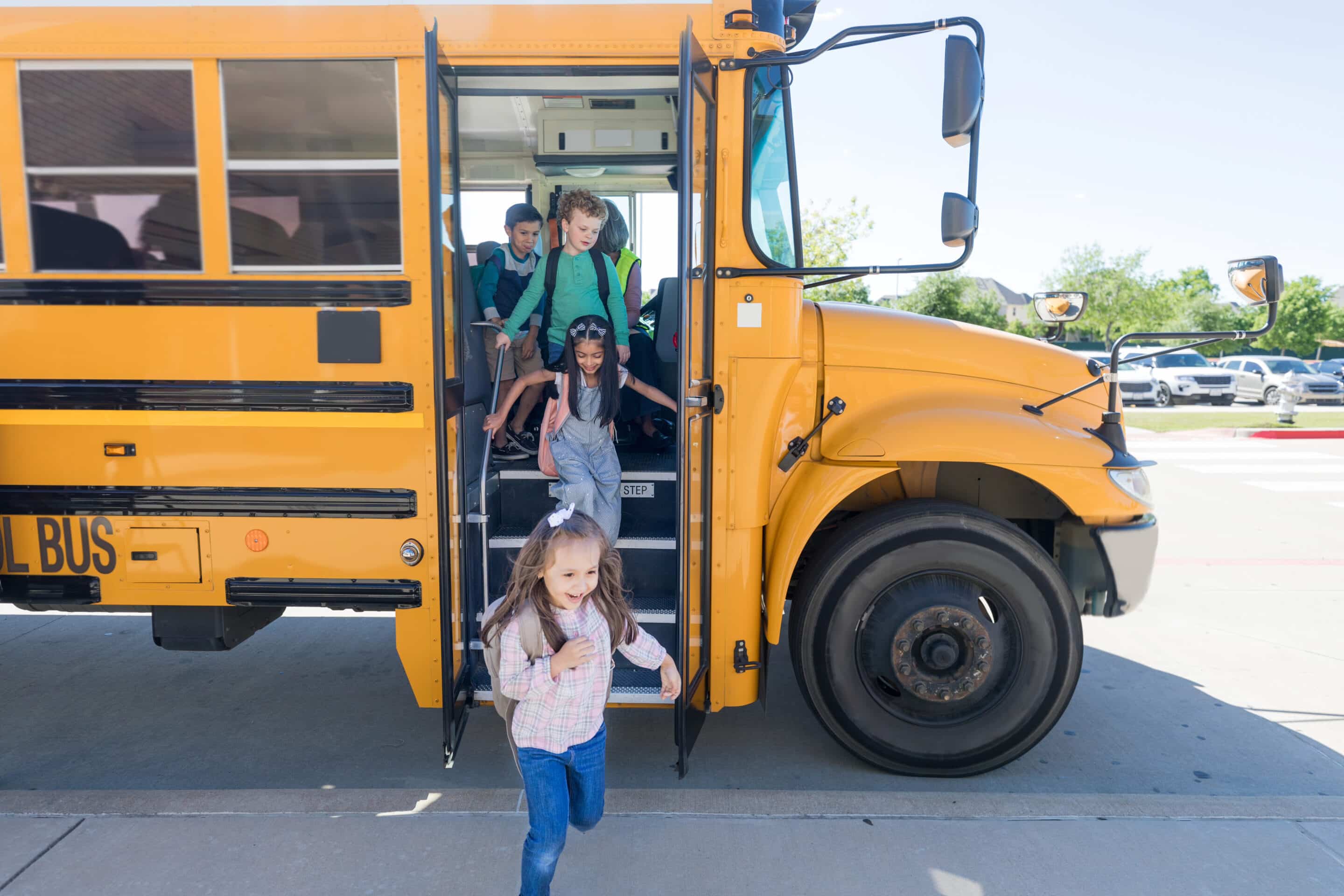 Back-to-School Tips for Parents Children getting off a school bus on their way to school